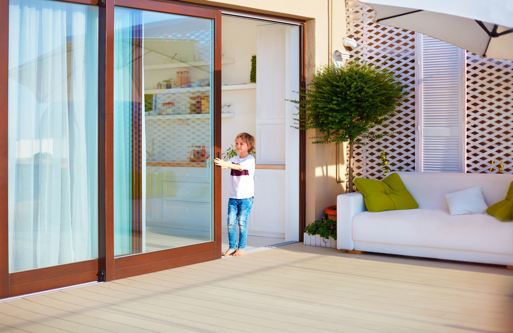 Happy,Young,Boy,,Kid,Opening,The,Sliding,Door,On,Rooftop