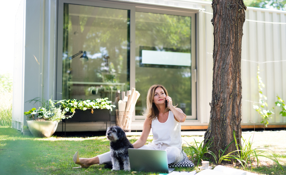 Mature,Woman,Working,In,Home,Office,Outdoors,In,Garden,,Using